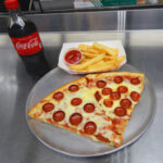 2 Slices of Pizza + Pop OR French Fries